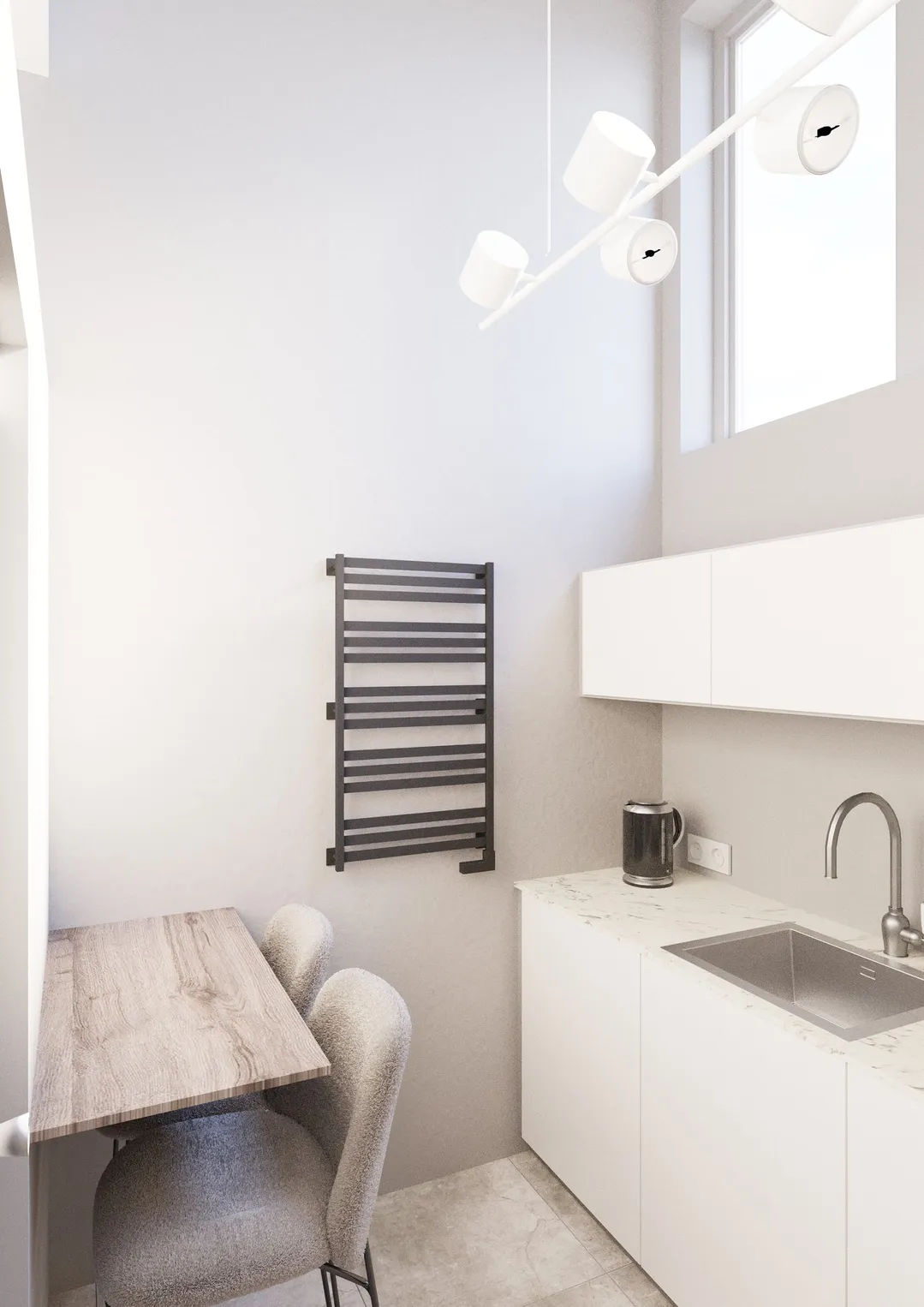 Przytulny nowoczesny aneks kuchenny z drewnianym stołem, białym blatem, zlewozmywakiem, czajnikiem, czarnym wieszakiem na ręczniki i lampą wiszącą.