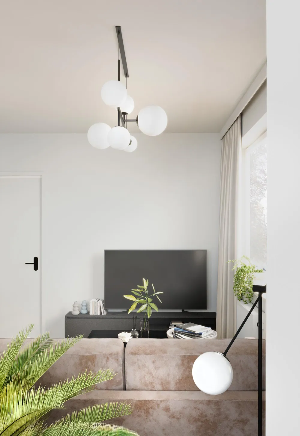 Minimalistyczny nowoczesny salon z białą ścianą, telewizorem, brązową sofą i wyjątkową lampą wiszącą.